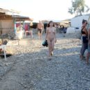 Shameless teen Renara walks naked at small market