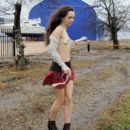 Skinny teen Natalia K undresses outdoors