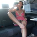 Smiling russian teen shows her hairy pussy and feet in car
