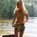 Sweet blonde Maria likes to walk with no clothes