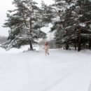 Sweet blonde Seshat plays with a snow