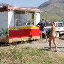 Totally naked girl buys beer in small shop