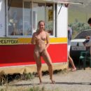 Totally naked girl buys beer in small shop