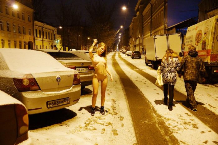 Naked blonde at winter streets