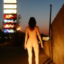 Oxana D posing naked at shoping mall parking