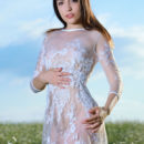 Gabriele strips her white dress baring her sexy, slender body outdoors.