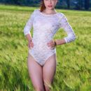 Gabriele shows off her sexy, slender body as she sensually poses on the rice field.