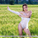 Gabriele shows off her sexy, slender body as she sensually poses on the rice field.