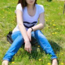 Soft white skin, dark hair and white pearls showcase Alina J and her natural beauty