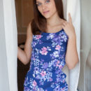 Zlatka A sitting on the steps in her pretty blue dress exposing her lucious dark labia