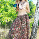Enjoying her magazine Erica B strips off her long floral skirt and exposes her lovely body