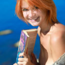 Pretty redhead named Violla basks under the morning sun, her smooth skin is glowing, and her enchanting smile brighten up her beautiful face.