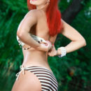 A fun and playful redhead named Beata C debuts with her tight yet curvy body.