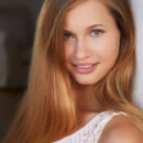 Stella Cardo uses a pillow as she poses her beautiful body on the floor nude.