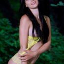Aleksandrina strips her yellow lingerie, baring her long, slender body in front of the camera.
