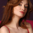Halena A in her silky red lingerie dress, sexy tresses, and red puckered lips will excite any budoir lover.