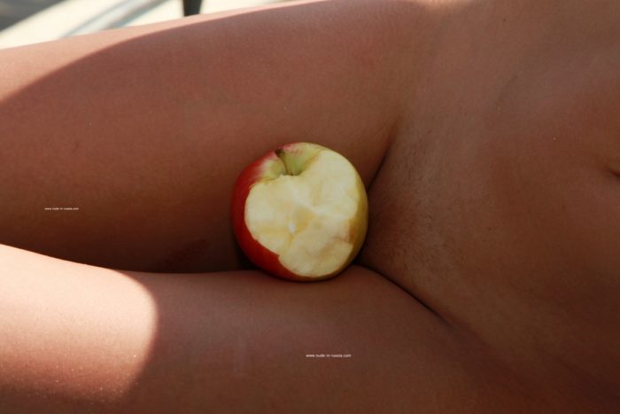 Beautiful redhead Margarita S eats apple on yacht