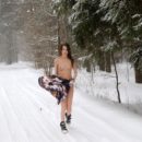 Beautiful teen Katrin on snowy road