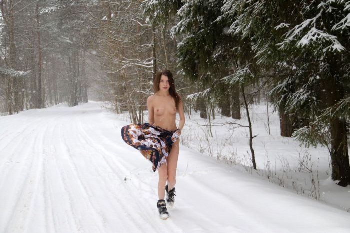 Beautiful teen Katrin on snowy road