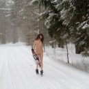 Beautiful teen Katrin on snowy road