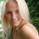 Jaime A is wearing a olive green dress and black belt showing off her gorgeous tight body