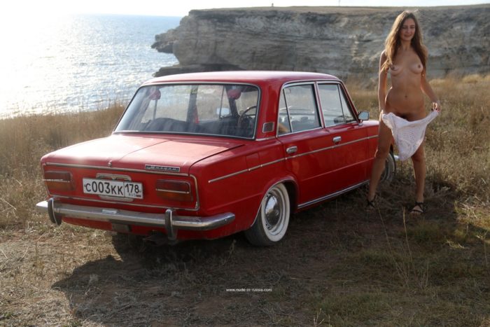 Lovely teen Valentina K near old car