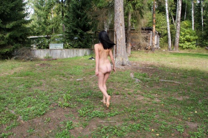 Naked brunette at abandoned camp