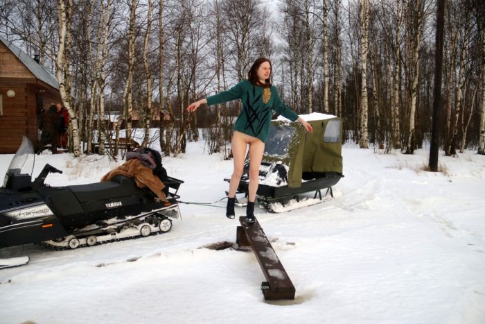 Redheaded Alina S rides snowmobile with a stranger