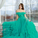 Rosie Lauren is beautiful in her big green gown. She takes it off and shows her shaved pussy.