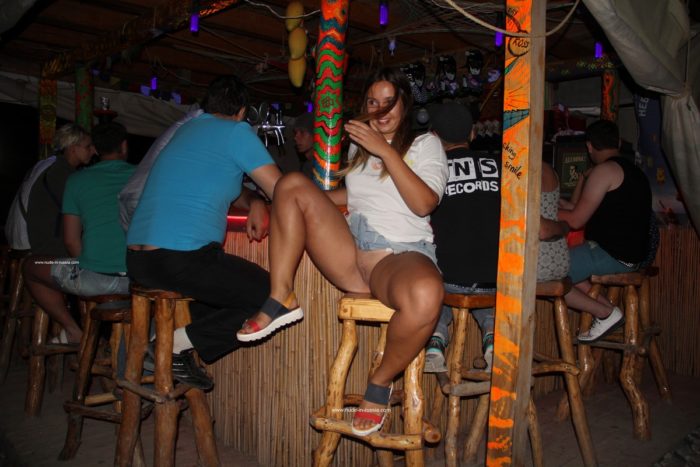 Shameless Nastia shows pussy at beach bar