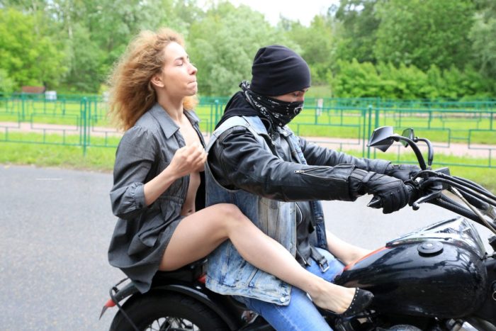 Sweet blonde Nara posing on motorcycle with a stranger