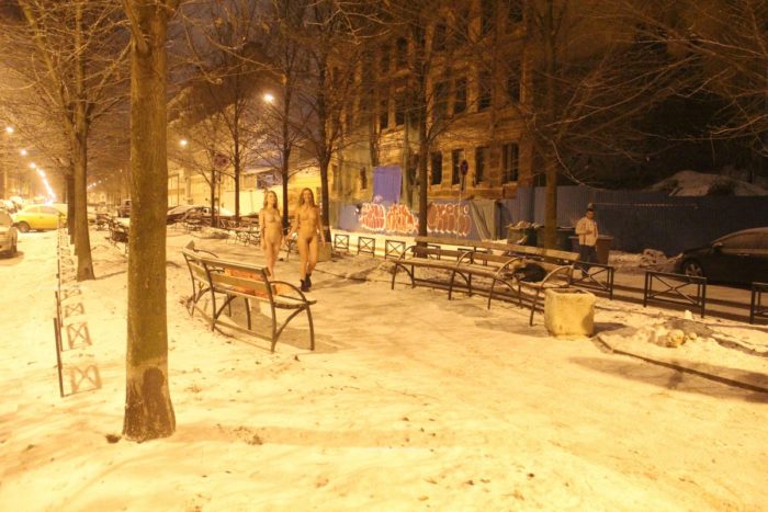 Two sexy ladies walks at winter streets