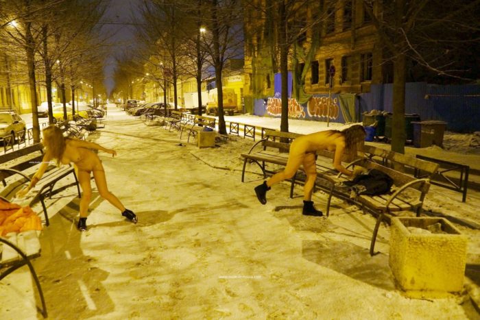 Two sexy ladies walks at winter streets