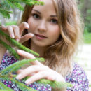 Jeff Milton is sitting pretty as a picture on a bench in her pretty floral dress