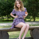 Jeff Milton is sitting pretty as a picture on a bench in her pretty floral dress