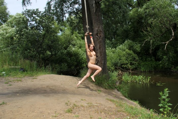 Naked girl Abbey rides bungee with spread legs