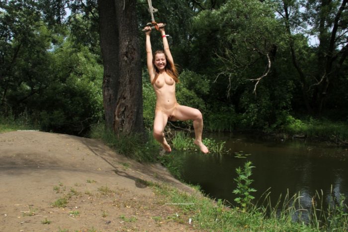 Naked girl Abbey rides bungee with spread legs