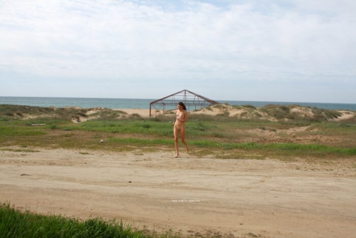 Naked russian girl Karina poses naked near sea