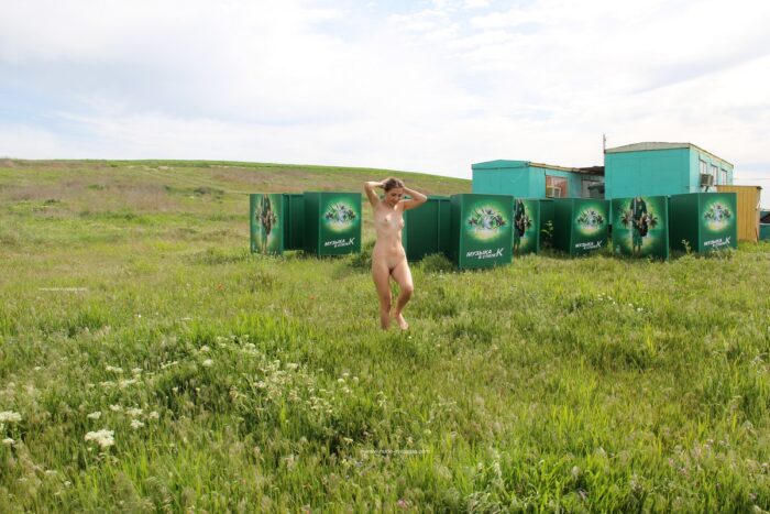 Naked russian girl Karina poses naked near sea