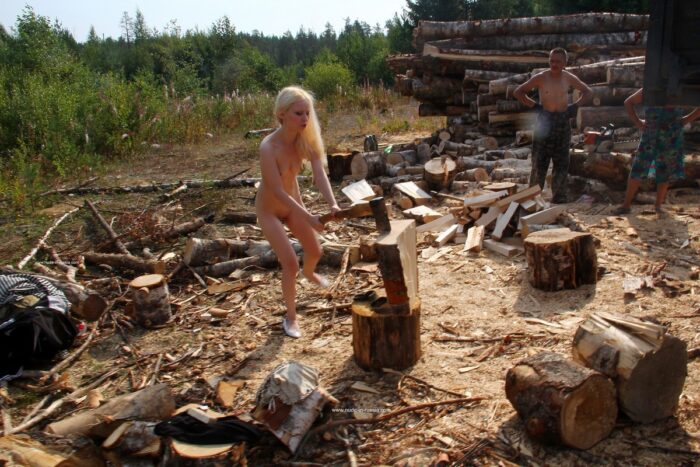 Naked teen Maria chopping wood