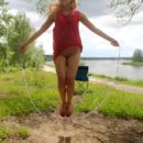 Russian teen Lera S masturbates with a jumping rope outdoors