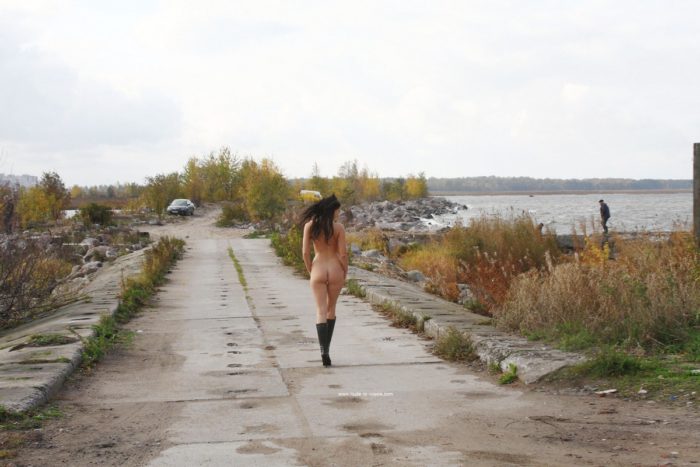Smiling brunette Masha S walks almost naked outdoors