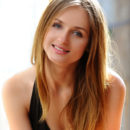 Vittoria A is stunning as she is modeling a black one piece bathing suite