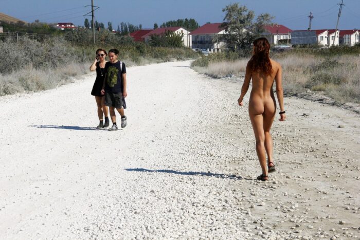 A girl without clothes asks the couple for directions