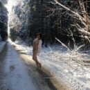 Brunette Klara on snowy road
