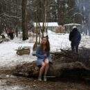 Busty teen Dana flashes her body by the winter fire