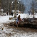 Busty teen Dana flashes her body by the winter fire