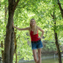 Maria Rubio takes off her red tank top and skinny shorts and strut bare naked by the riverbank.