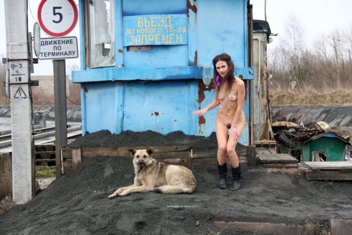 Naked Nadeshda N posing with guard dog
