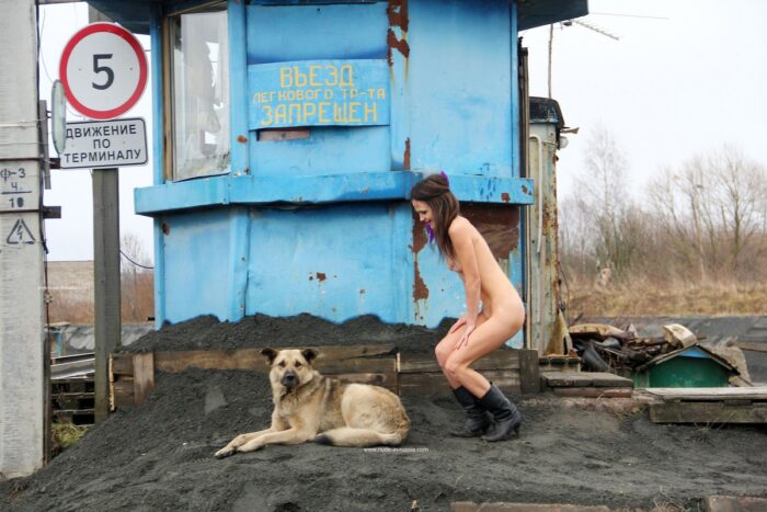 Naked Nadeshda N posing with guard dog